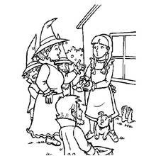 Coloriage Magicien accueilli par une fillette et de petits personnages