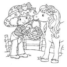Coloriage Fraisinette offrant une fraise à un poney