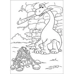Coloriage Arlo transportant un bâton près d'un enclos rocheux