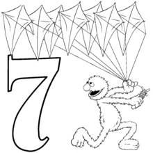 Coloriage Grover tenant sept cerfs-volants près du chiffre 7