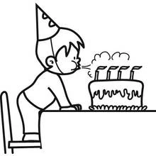 Coloriage Garçon soufflant les bougies d'un gâteau d'anniversaire