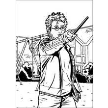 Coloriage Harry Potter pointant sa baguette en extérieur
