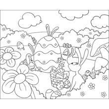 Coloriage Lapins jouant avec un œuf de Pâques géant