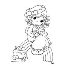 Coloriage Petite fille assise sur un arc-en-ciel avec un sac de cœurs