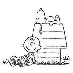 Coloriage Snoopy endormi sur sa niche avec Charlie Brown