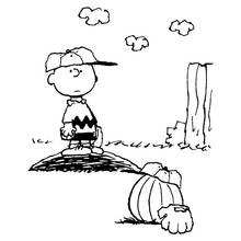 Coloriage Snoopy avec Charlie Brown sur un monticule de baseball
