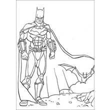 Coloriage Batman debout avec une chauve-souris qui vole