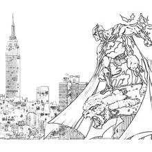 Coloriage Batman perché sur un toit au-dessus de la ville