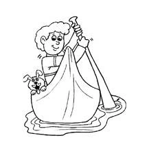 Coloriage Garçon pagayant en canot avec son chien